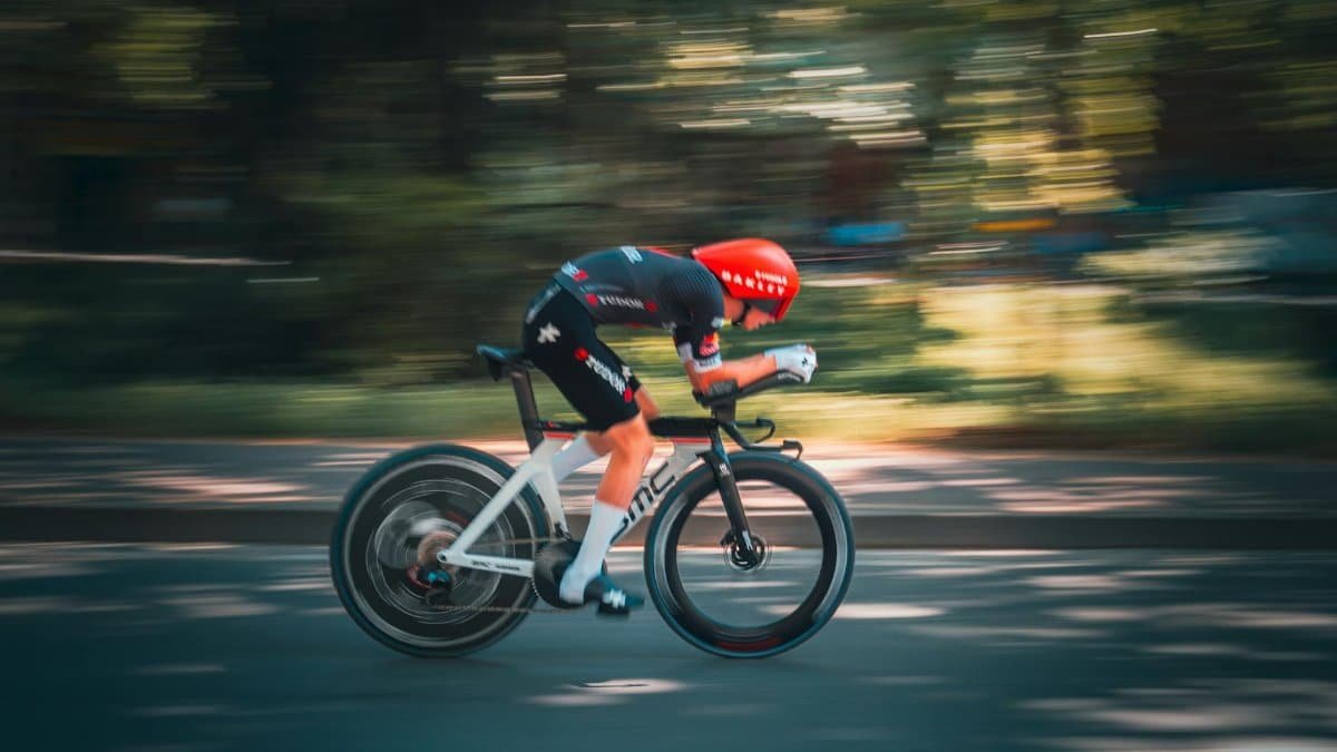 Dynamic shot of a cyclist racing on a sunny day in Tirana, capturing the essence of speed and agility.