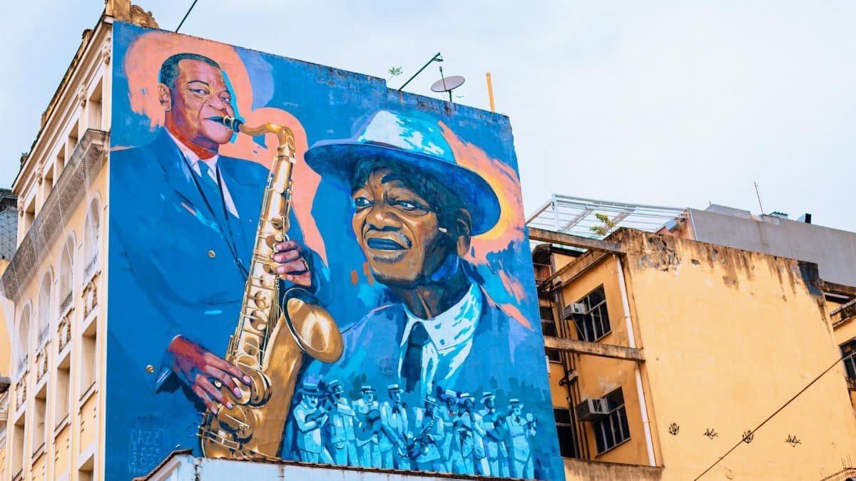 Colorful mural depicting jazz musicians on a building façade in Rio de Janeiro, Brazil.