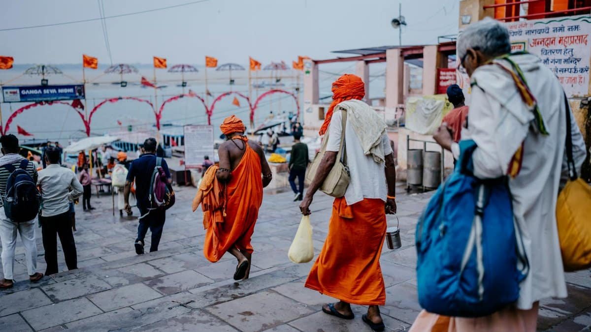 Monks and devotees at a spiritual gathering on the Varanasi ghats in India, capturing cultural heritage and daily life.
