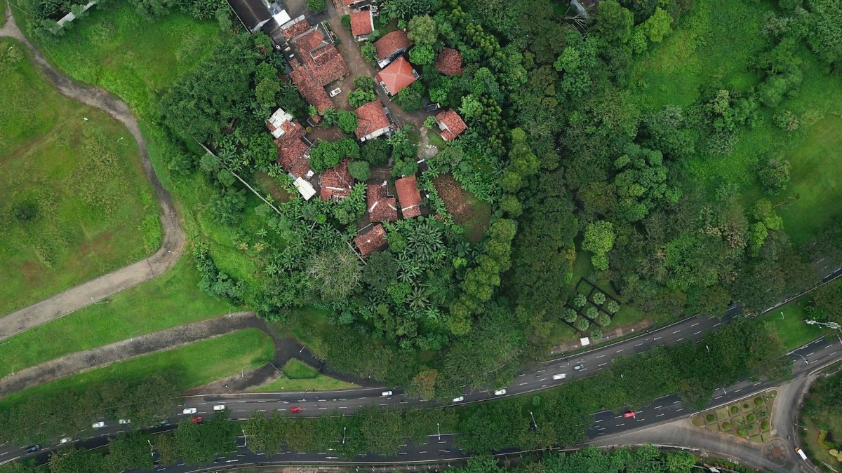Aerial shot showing a residential area surrounded by greenery in Serpong, Banten, Indonesia.