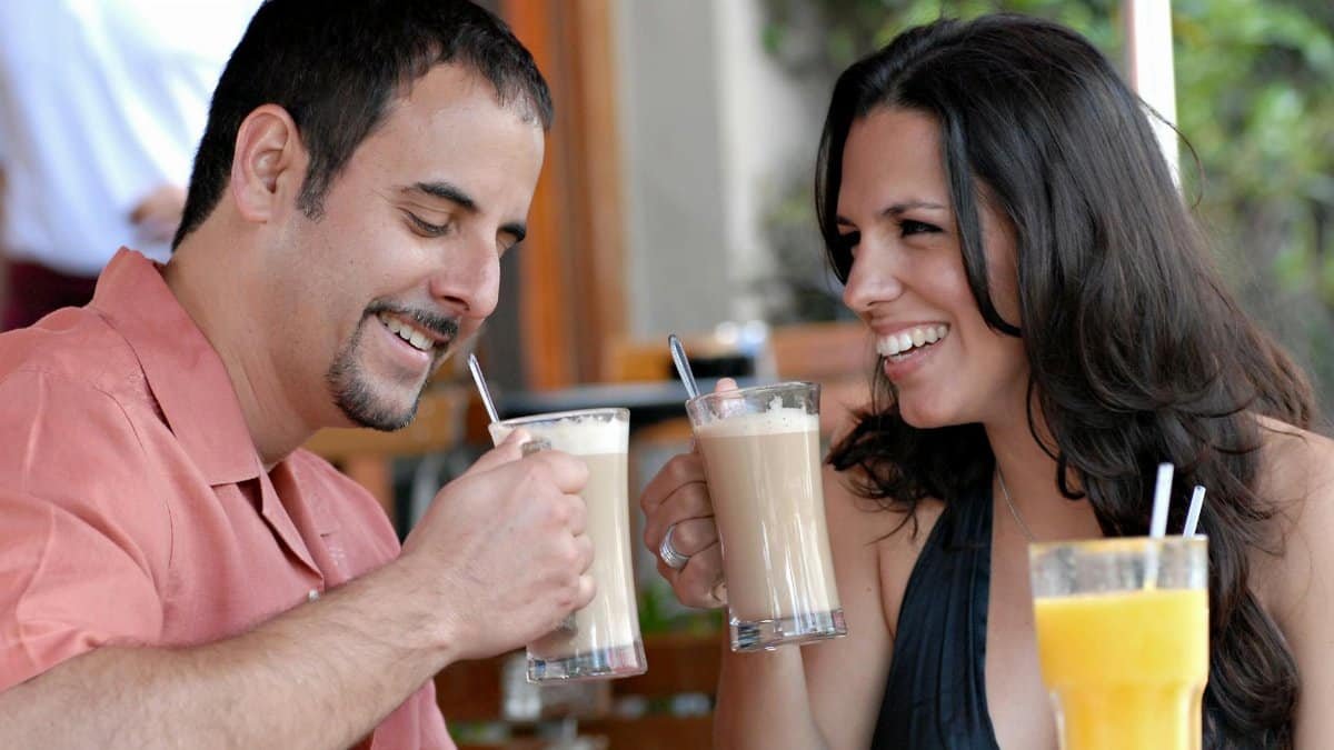 Attractive Couple on a Date at a Cafe on Miami Beach, FL