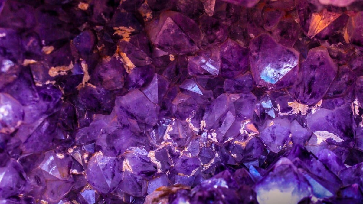 Close-up view of a beautiful amethyst crystal cluster showcasing its vibrant purple hues and natural texture.
