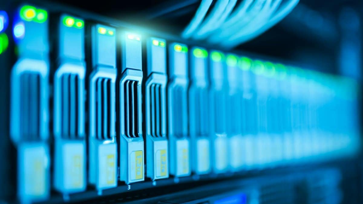 Detailed image of a server rack with glowing lights in a modern data center.