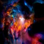 Vibrant long exposure portrait with colorful light painting effects.
