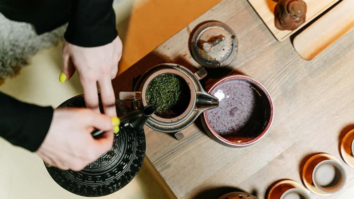 A serene tea ceremony in progress, highlighting the artful preparation and brewing of tea.