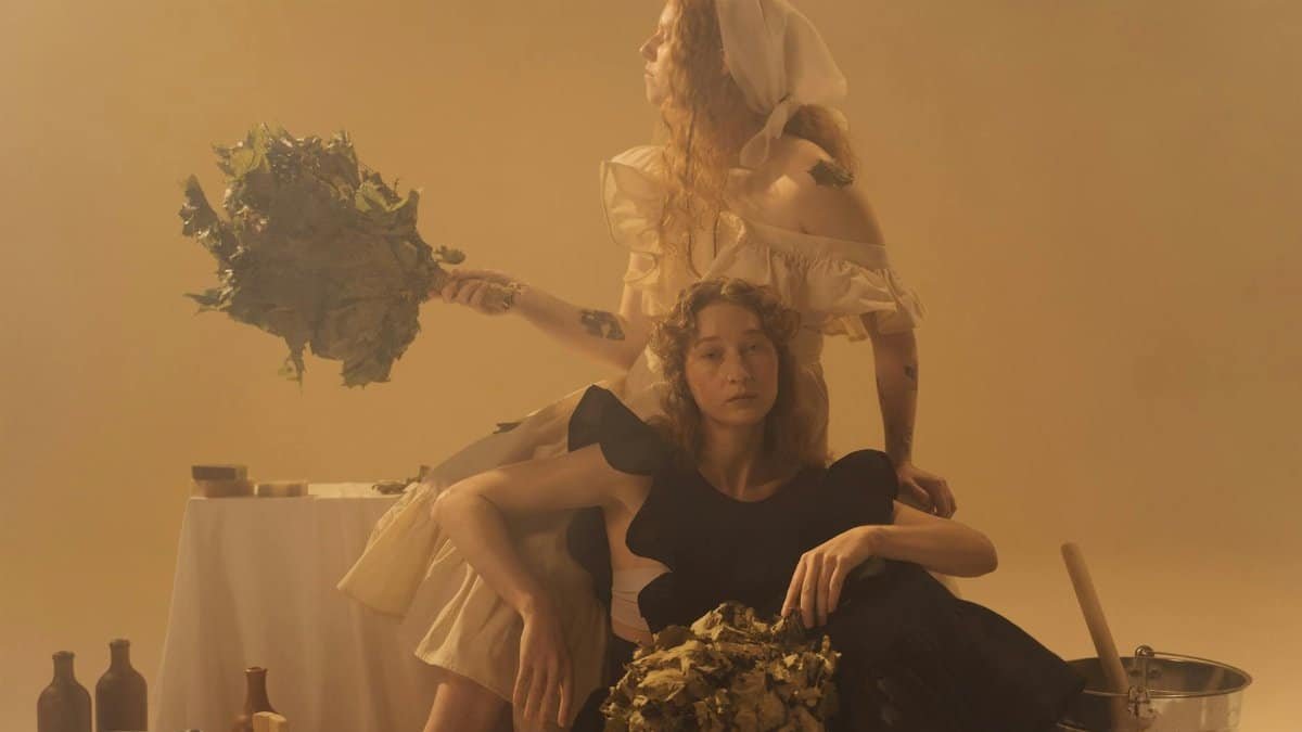 Two women enjoy a calming sauna experience, evoking wellness and tranquility.