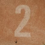 Close-up of number two on a track starting line, perfect for sports themes.