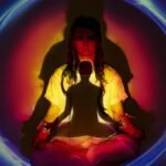 A woman in meditation surrounded by colorful auric light, creating a spiritual atmosphere.