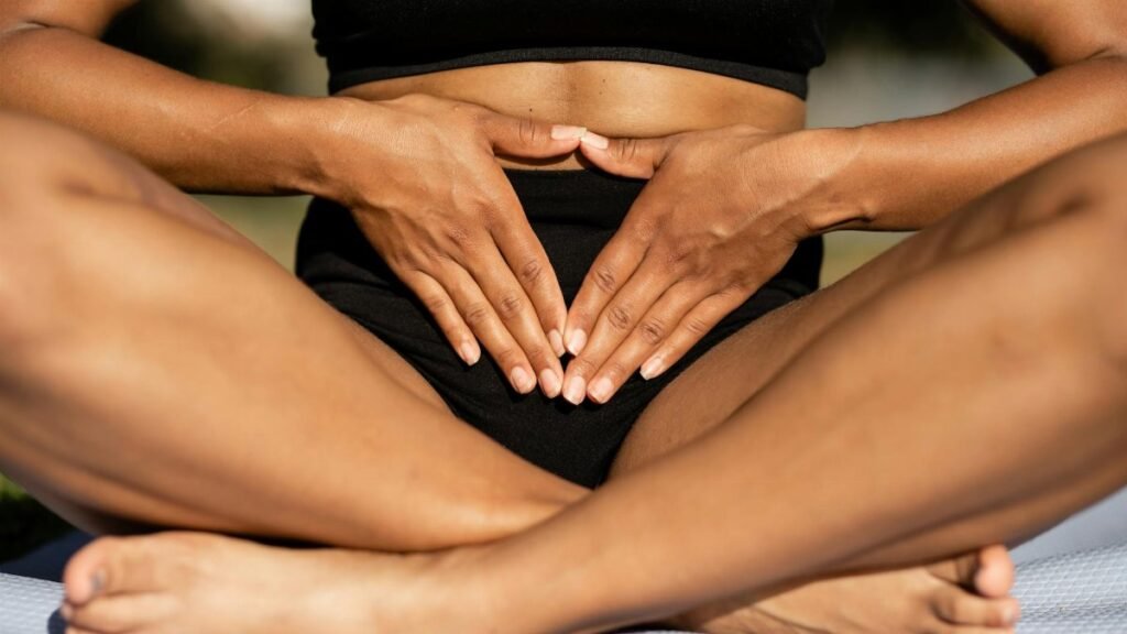 A person practicing yoga meditation outdoors on a sunny day, focusing on mindfulness and relaxation.