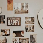 Gallery wall with photos, art, and an inspirational sign, featuring a cowboy hat.