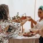 Three women practicing a spiritual ritual indoors, fostering connection and balance.