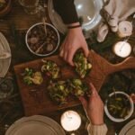 Warm and inviting holiday table with festive decorations and appetizers.