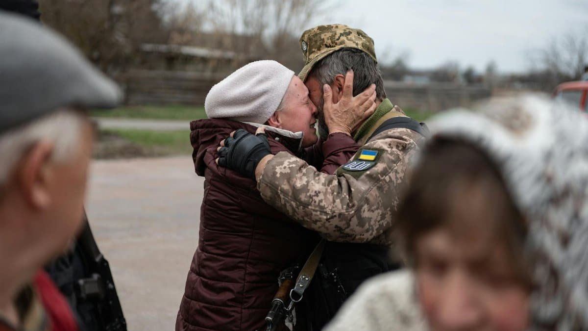 Heartfelt embrace in Makariv, Ukraine, capturing the emotional reunion.