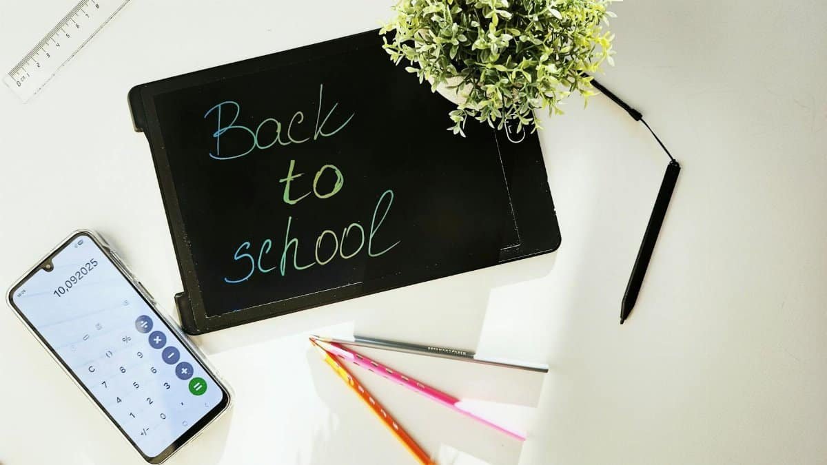 A vibrant back-to-school workspace featuring stationery and a tablet.