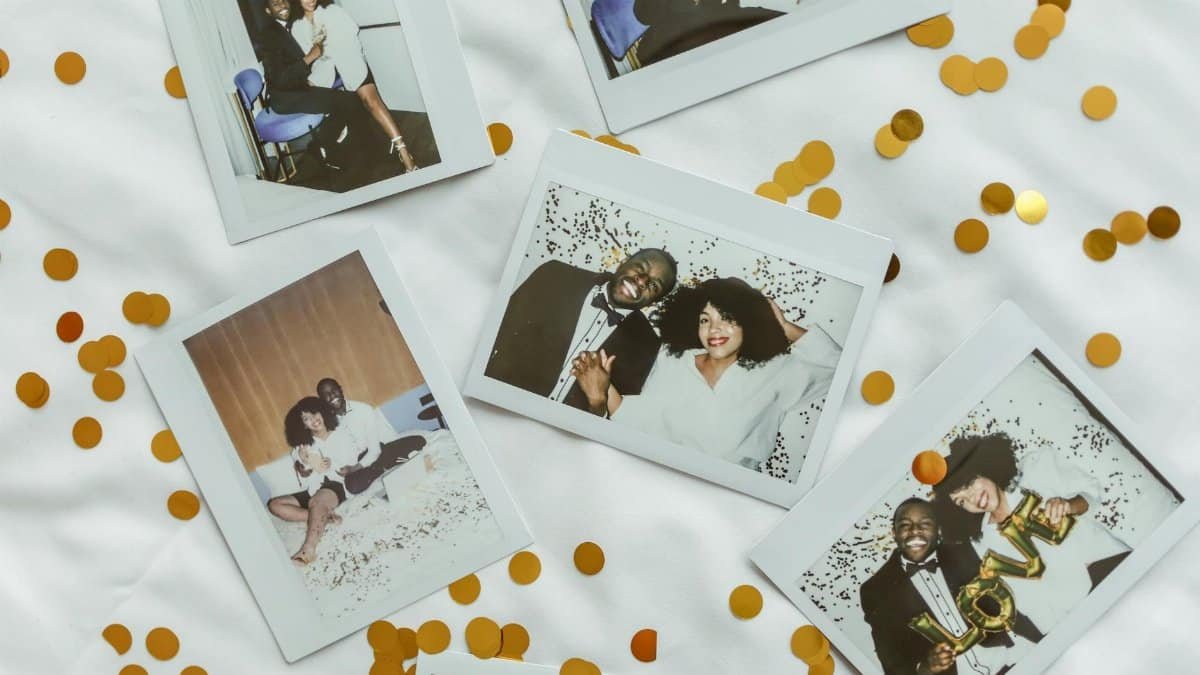 Capture of a couple's joyful moments in polaroid pictures surrounded by confetti.