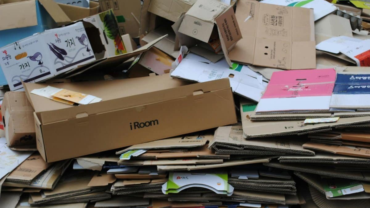 Pile of used cardboard boxes for recycling, ideal for environmental themes.