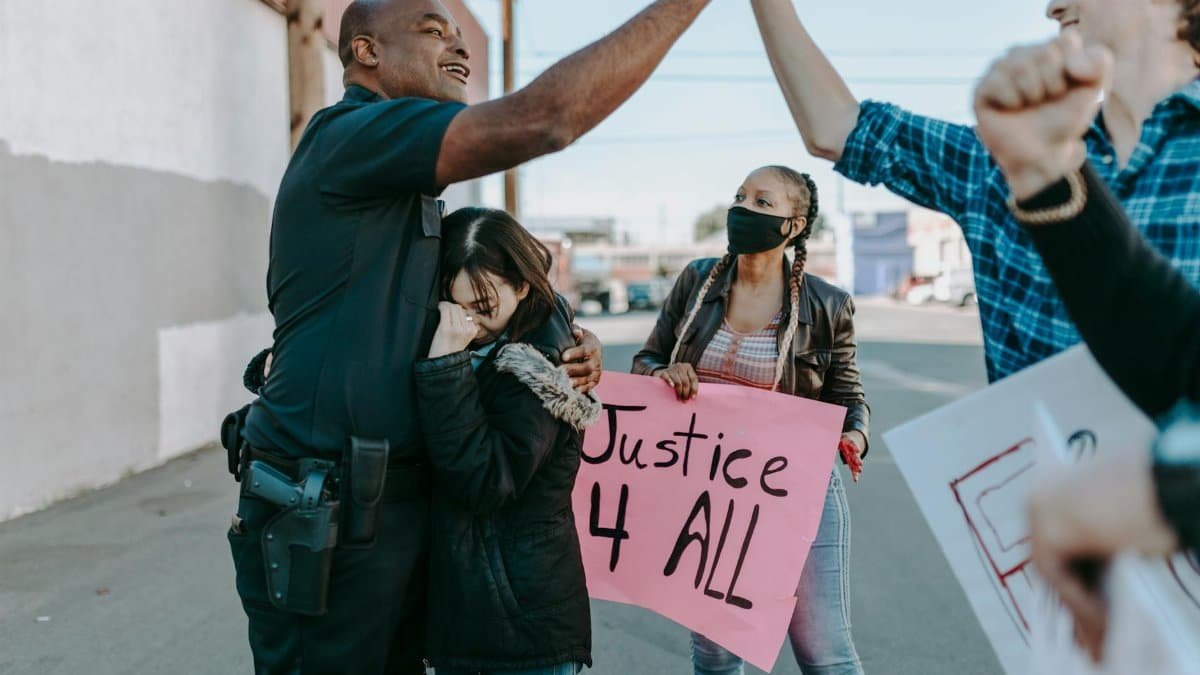 A diverse group of people peacefully protesting for justice and equality.