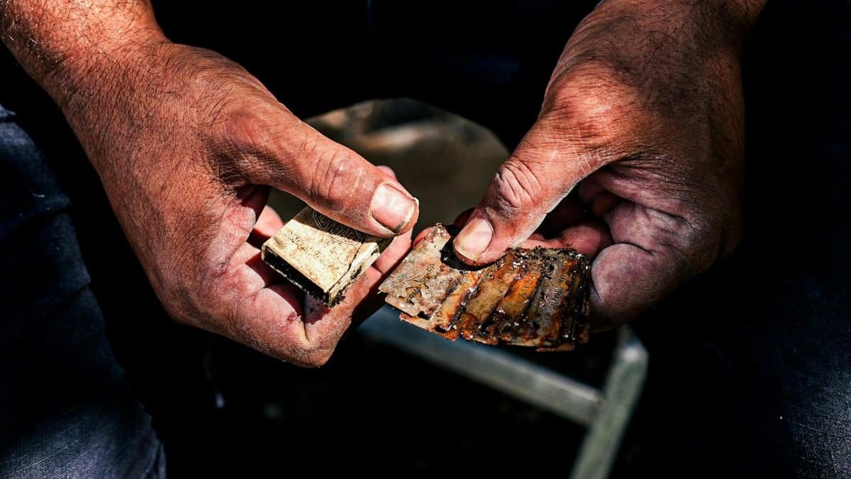 Close-up of a craftsman's hands holding rustic tools, displaying skilled artistry in Sütçüler, Türkiye.