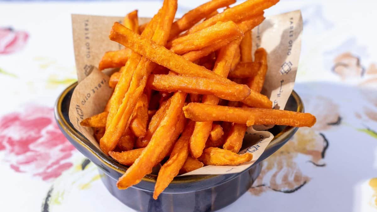 Crispy sweet potato fries served in a bowl, perfect snack or side dish.