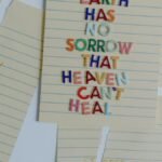 Torn papers with an uplifting quote emphasizing healing and overcoming anxiety and stress.