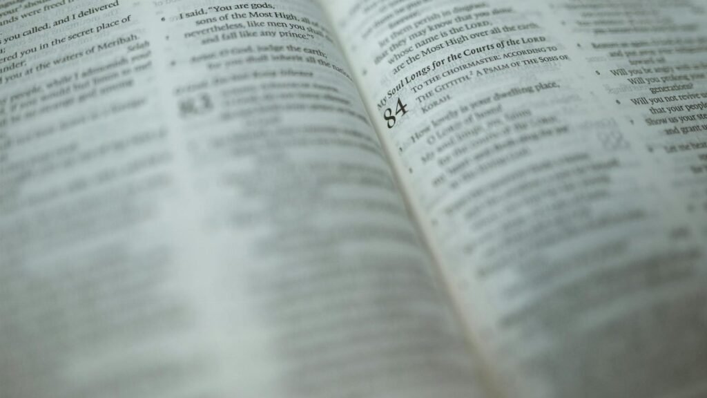 A detailed close-up of a Bible page with a highlighted Psalm, symbolizing faith and spirituality.