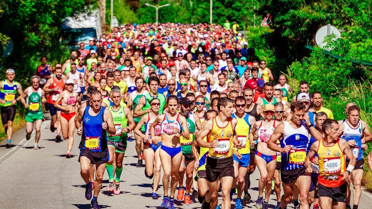 Energetic marathon runners competing on a sunny day, showcasing perseverance and community spirit.