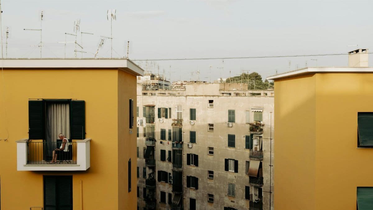 View of residential buildings with balconies, featuring serene urban living.