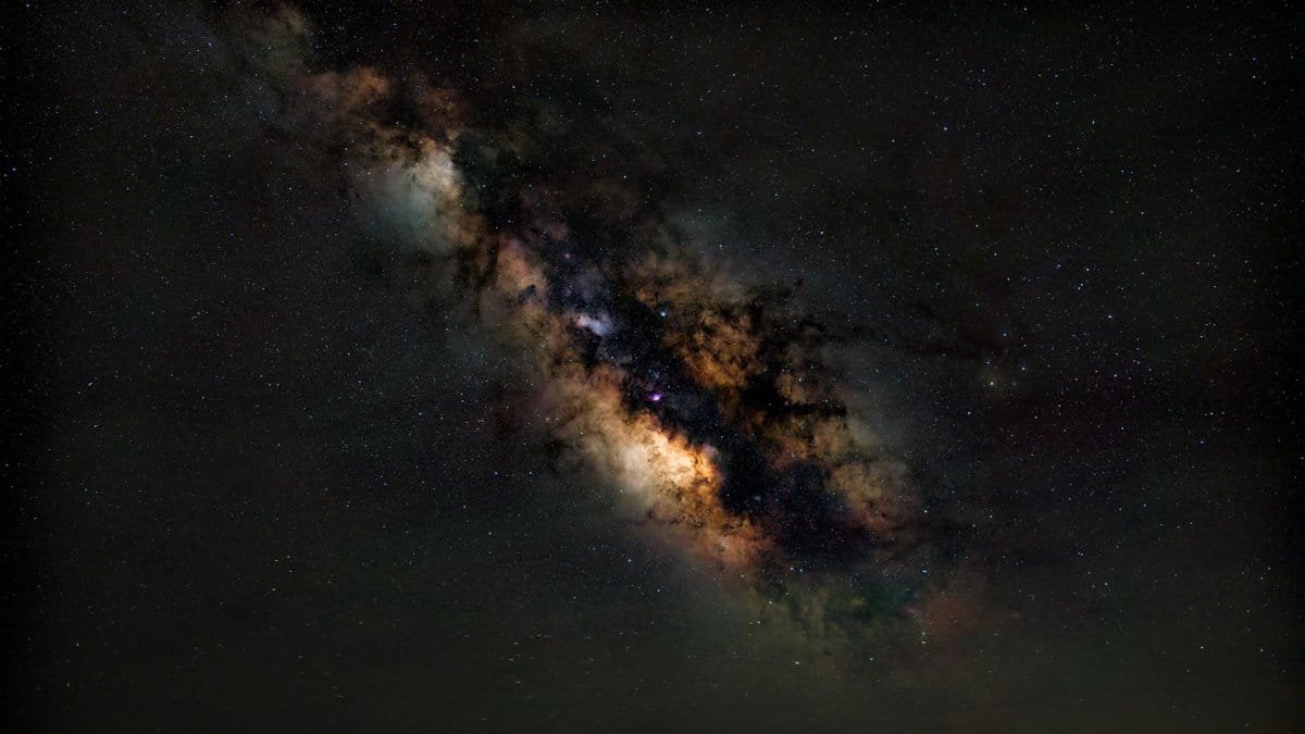 A breathtaking view of the Milky Way galaxy illuminating the night sky above Valencia, Spain.