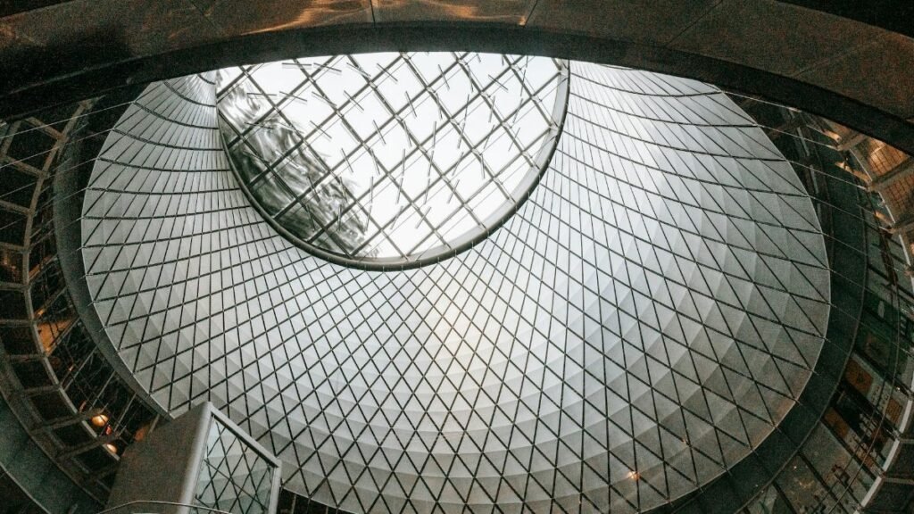A striking view of a geometrically designed glass dome ceiling in a modern interior.