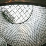 A striking view of a geometrically designed glass dome ceiling in a modern interior.