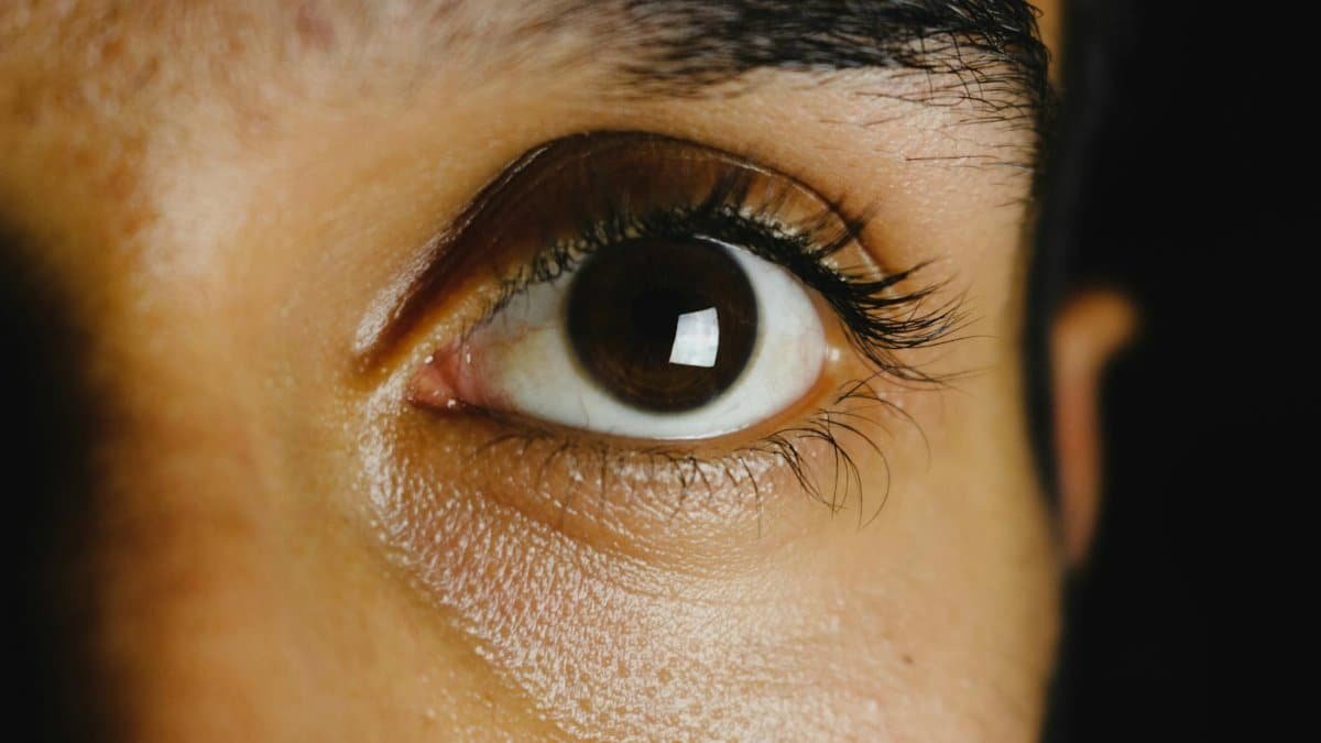 Intense close-up shot capturing the details of a human eye.