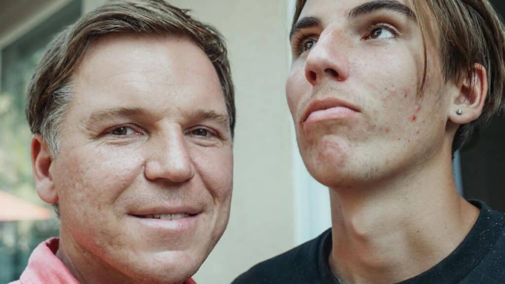 Close-up of father and teenage son posing together, showcasing family resemblance and natural expressions.
