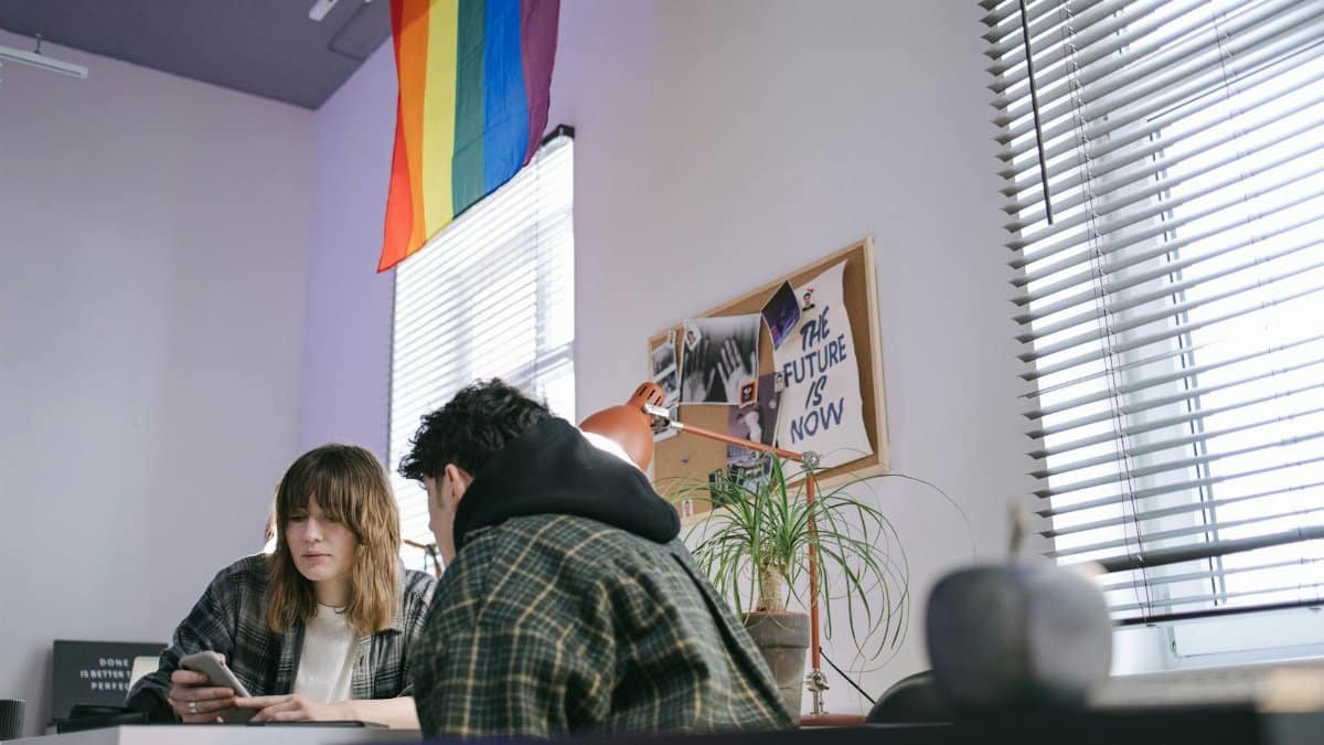 Two colleagues working together in a trendy office space with a focus on creativity and teamwork.