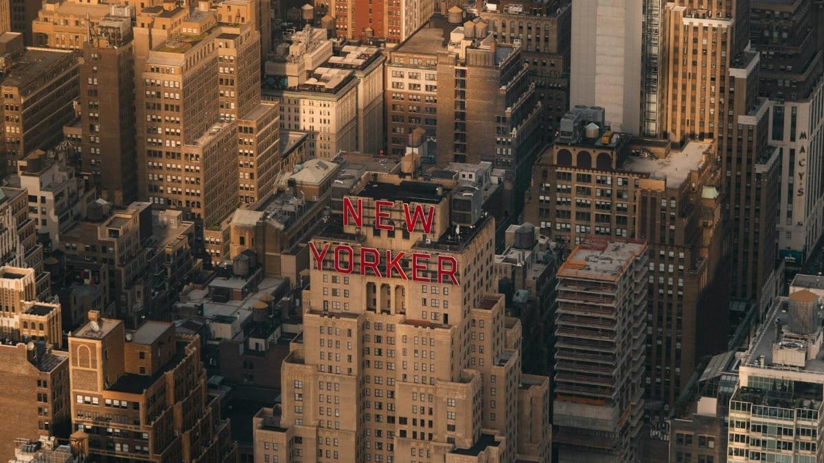 Aerial view of the New Yorker Hotel amidst Manhattan's vibrant skyline.
