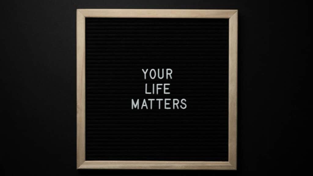 A chalkboard with the motivational message 'Your Life Matters' in white letters.