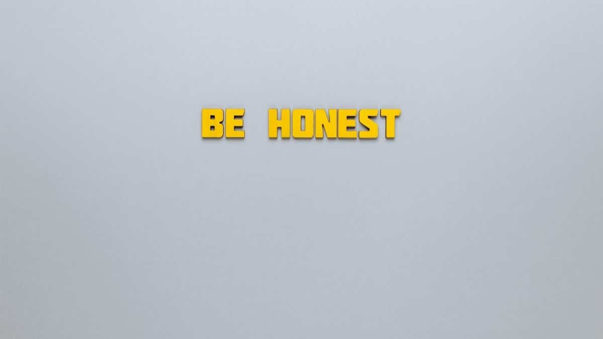 Simple yellow text 'Be Honest' on a neutral background, emphasizing clarity and inspiration.