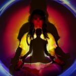 Woman meditating with vibrant aura and energy field.