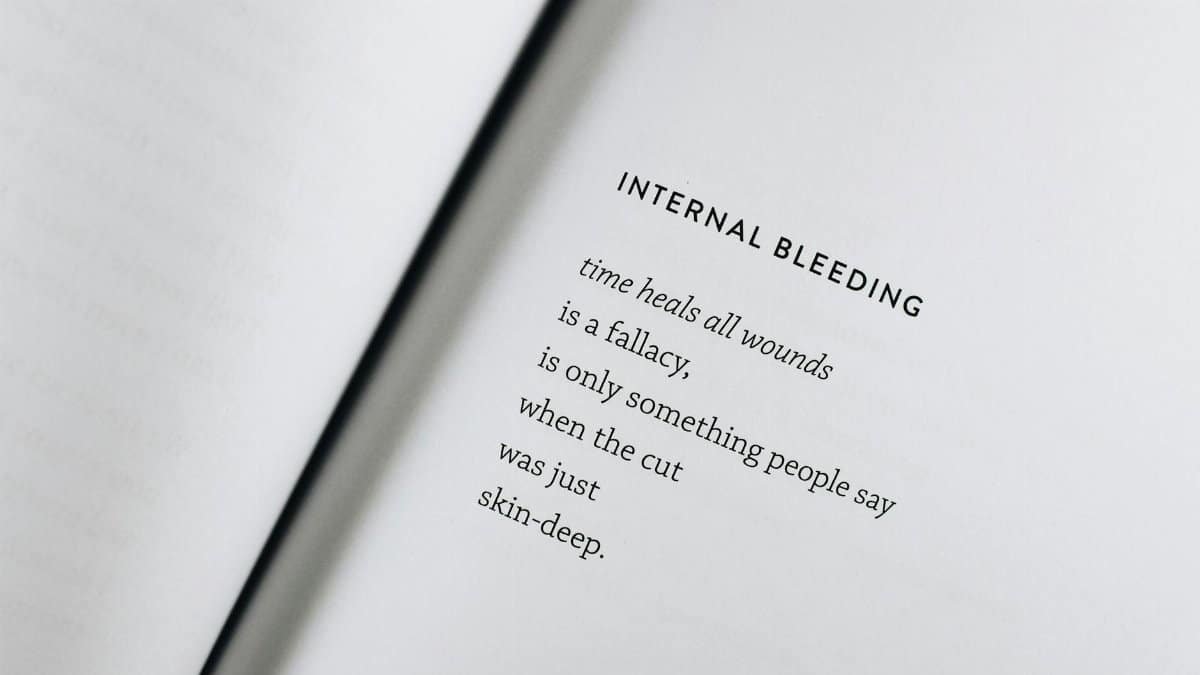 A black text poem on an open white page capturing the essence of healing and reflection.