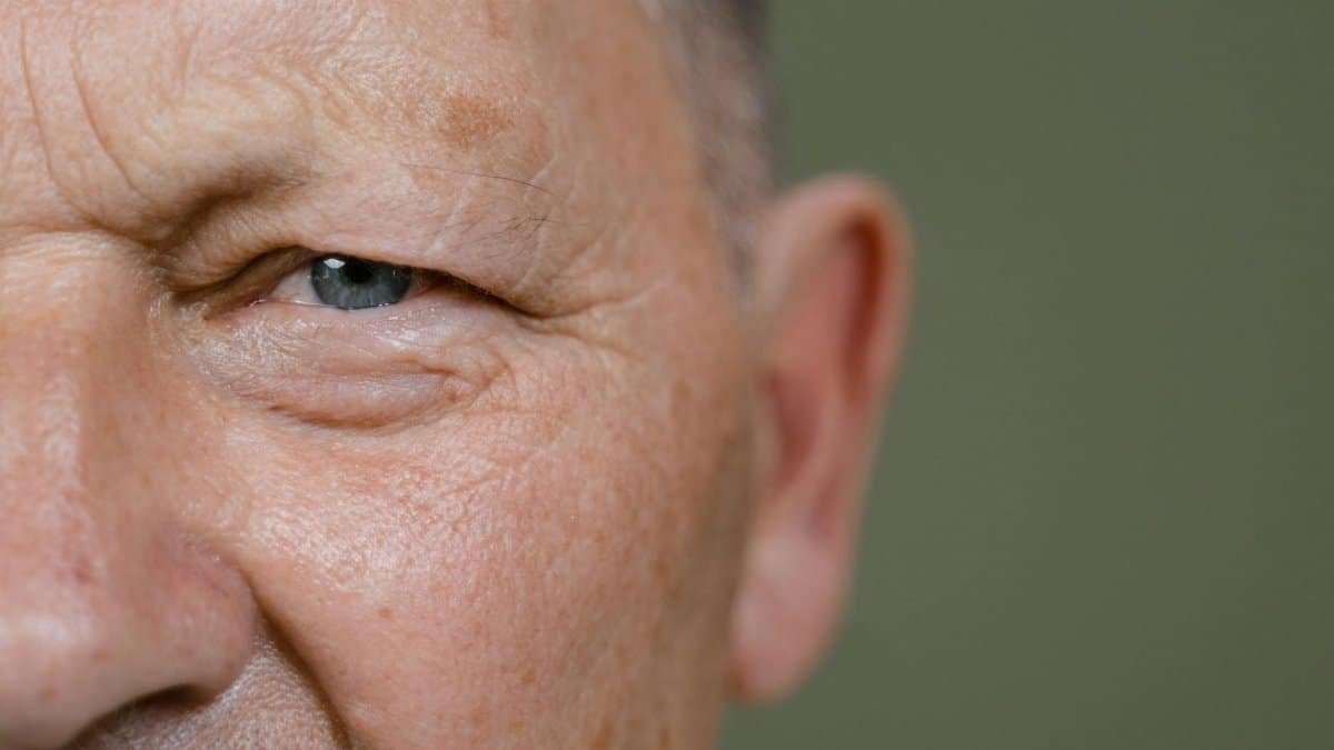Detailed close-up of a senior man's eye, showcasing texture and expression.