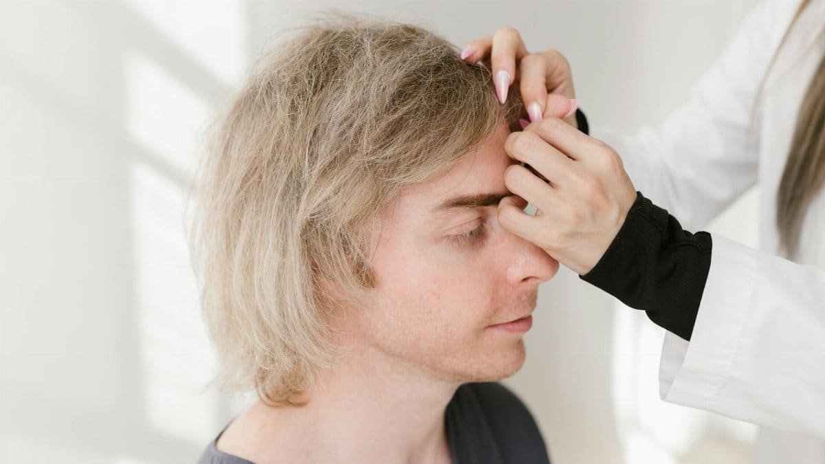 Close-up of a man enjoying acupuncture therapy for holistic health and wellness.