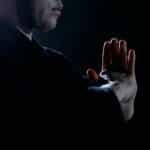 Captivating studio shot of martial artist in traditional attire, embodying focus and discipline.