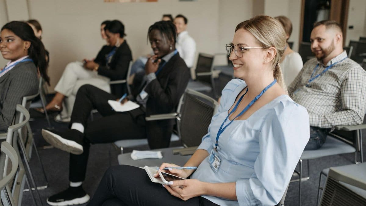 Participants attentively engage in a seminar, showcasing diversity and collaboration.