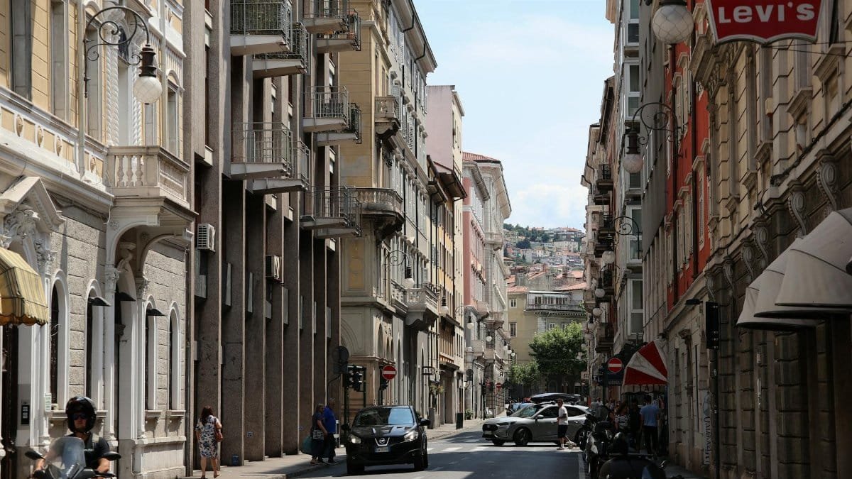 Discover the vibrant urban scene of Trieste, Friuli-Venezia Giulia, showcasing classic architecture and city life.