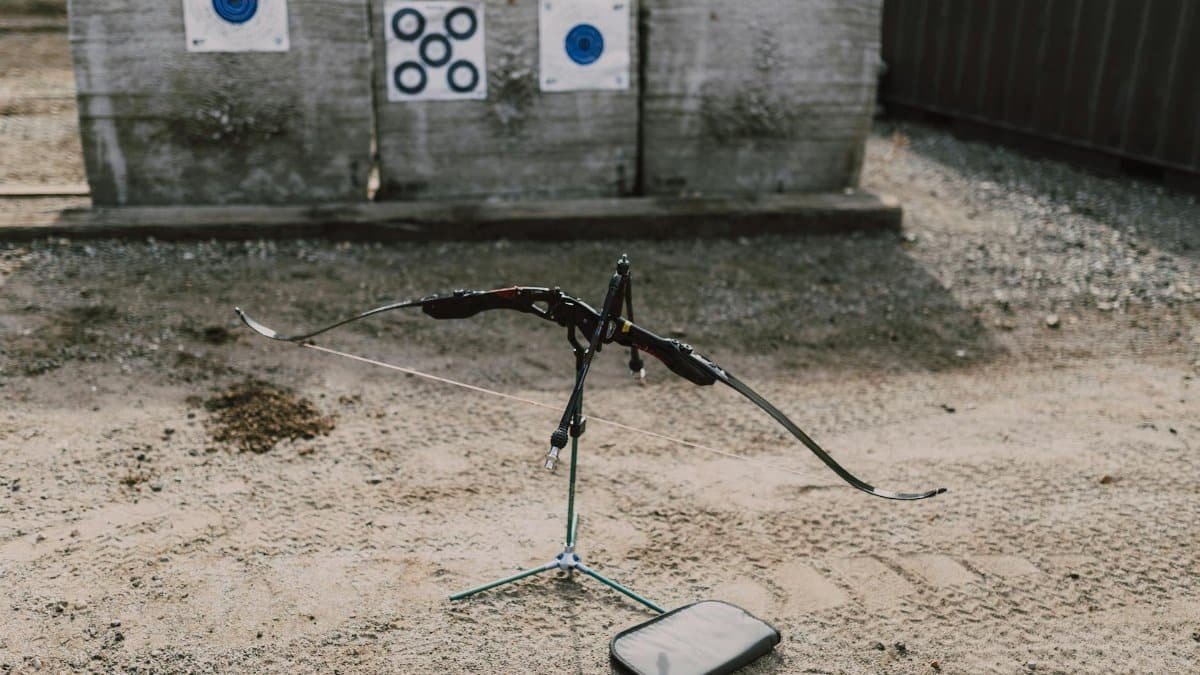 Traditional archery setup with bow and targets at an outdoor range, perfect for practice.