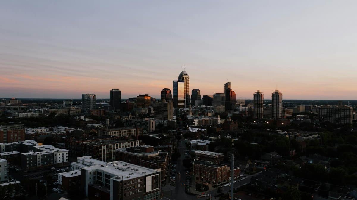 A stunning aerial view of Indianapolis skyline during sunset, showcasing urban architecture.