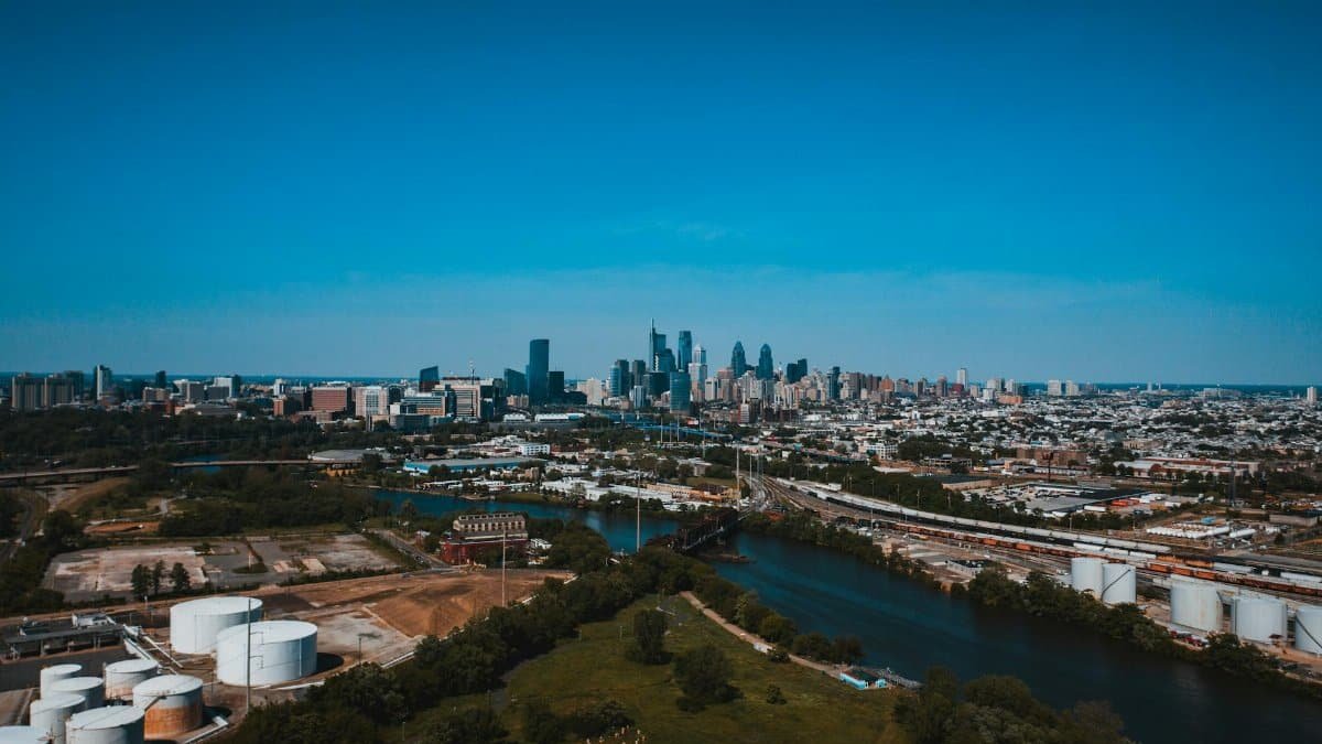 Stunning aerial view of Philadelphia's skyline with clear blue skies and vibrant urban landscape.