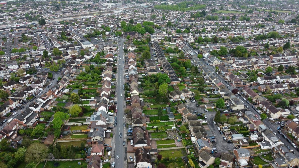 Aerial view of a residential neighborhood in Luton, England, showcasing streets and rooftops.