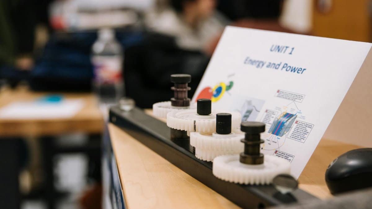 Close-up of gears demonstrating energy and power concepts in an educational setting.