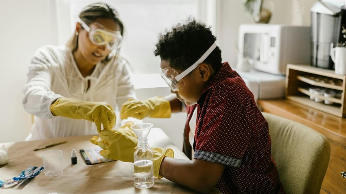 Mother and son conducting a fun science experiment together at home, fostering creativity and learning.
