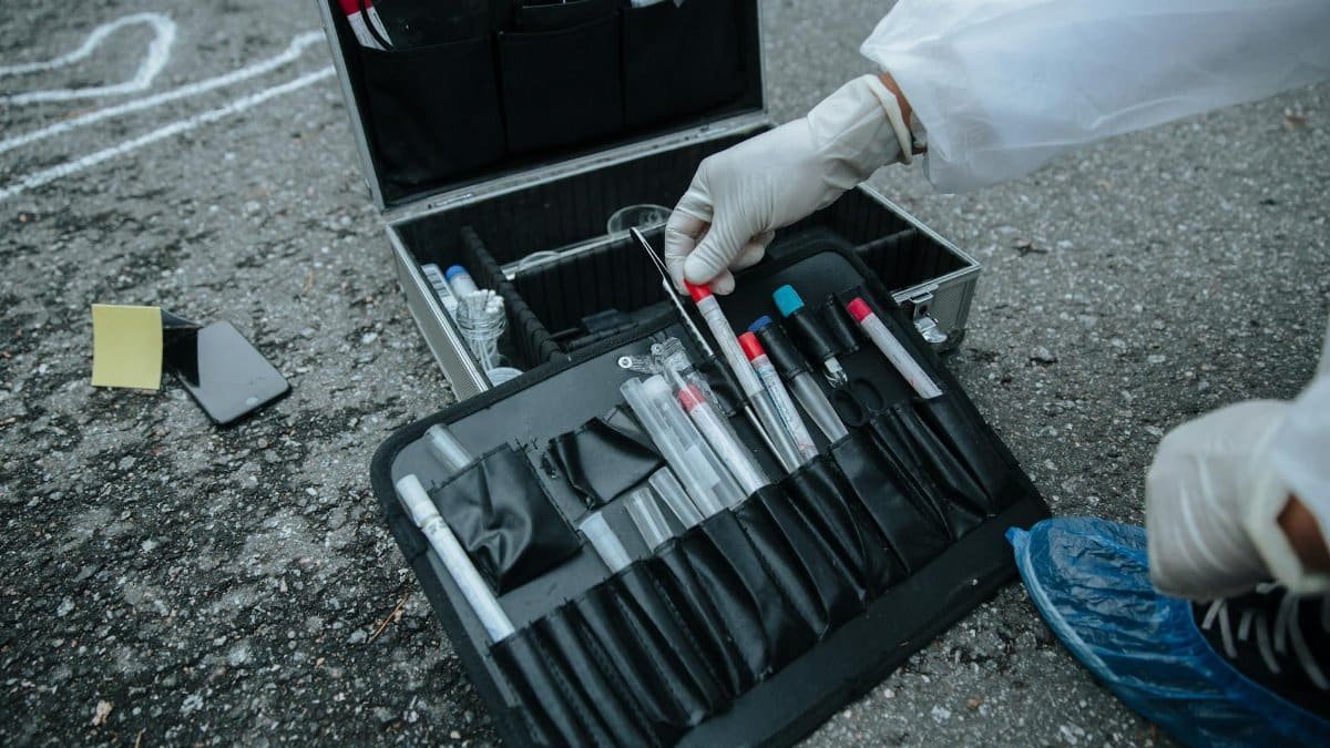 Close-up of investigator tools at a crime scene, showcasing precision and detail.